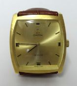 Gents 18ct yellow gold Omega De Ville Tonneau shaped mechanical manual wind watch champagne dial