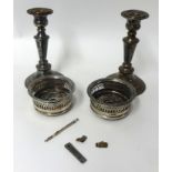 Pair Elkington EP candlesticks, pair silver plated small bottle coasters, silver swizle stick, tie
