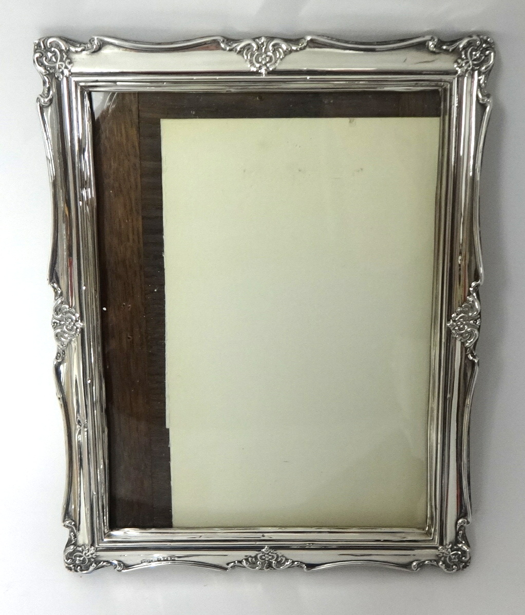A George V silver photo frame, 26cm x 20cm circa 1911, HCF