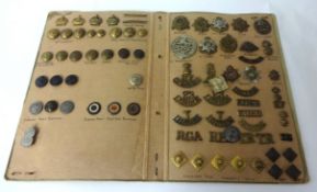 A collection of WWI and other cap badges and buttons and 'Officers Pips'