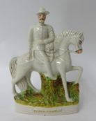 A Staffordshire flat back figure-B-P on Horseback, with left hand across his chest