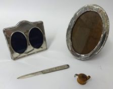 Victorian silver fruit knife, miniature sewing tape, and two silver frames (4)