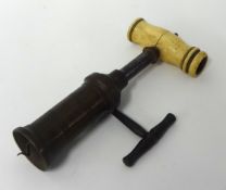 A Victorian Corkscrew, having brass barrel, turned ivory handle (lacking dusting brush)