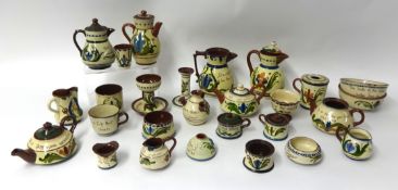A collection of Torquay pottery including motto ware and Scandy designs, 23 pieces