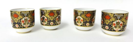 Four Crown Derby egg cups and a pair of Copeland Spode plates, and a pair of other plates one