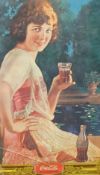 A Coca Cola advertising picture, 44cm x 24cm, (cracked glass)
