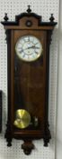 Vienna style single train wall clock, with pendulum and brass cased weight, approximately 116cm long