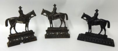 Pair B-P on horseback hearth ornaments in cast iron and another similar (3)