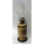 A Victorian oil lamp, Doulton, decorated with flowers, with brass Hink & Sons burner, etched glass