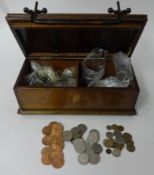 An old tie press box containing a large quantity of general coinage