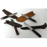 Four knives including Devon 1964 Jamboree sheath knife, Taylors of Sheffield sheath knife &