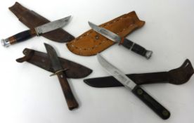 Four knives including Devon 1964 Jamboree sheath knife, Taylors of Sheffield sheath knife &