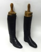A pair of 19th century boots with wooden trees, height 44cm