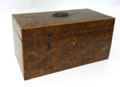 A 19th century burr walnut tea caddy fitted with boxes and mixing bowl