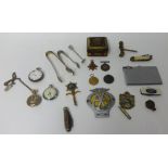 A collection of items including three pocket watches, four pen knives, car badge and medals