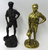 Heavy brass statue of a Boy Scout holding his hat and a large plaster statue of a Boy Scout standing