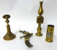 Four brass items including B-P finial candle stick, running Boy Scout car badge, Boer War Generals