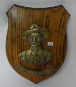 Two plaques including B-P on wood shield and bronze plaque 'Maj Gen B-P Mafeking 1900' in round