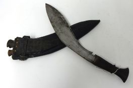 A Kukri knife in scabbard