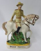 A Staffordshire flat back figure-B-P on Horseback, left hand holding horses mane
