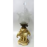 A porcelain table lamp modelled as three elephants with etched glass shade, possibly Royal Dux, 42cm