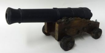A heavy cast iron table canon 40cm long