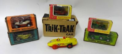 Five Matchbox diecast Spot On Trick Trak cars (boxed)