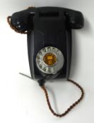 A black bakelite wall phone