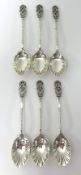 A cased set of six pretty silver teaspoons with decorative finials and scalloped bowls