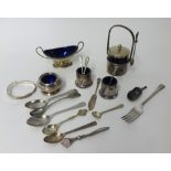 A London twin handled silver table salt with blue glass liner, a silver bangle (broken), spoons