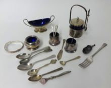 A London twin handled silver table salt with blue glass liner, a silver bangle (broken), spoons