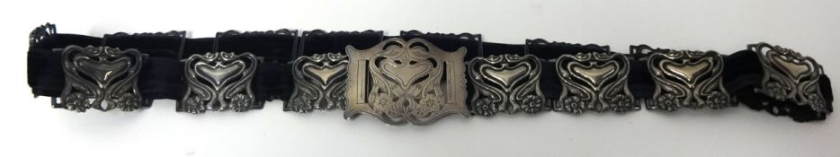 An Art Nouveau design silver belt set on a belt band, approximately 18cm long, A.J.S Birmingham