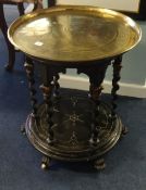A Victorian ebonised table base together with an associated brass tray, the base with six barley