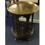 A Victorian ebonised table base together with an associated brass tray, the base with six barley