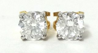 Pair of single stone Diamond stud earrings, comprising a pair of round brilliant cut Diamonds. Total