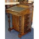 A late Victorian rosewood and marquetry inlaid Davenport