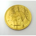 An Iranian Pahlavi gold coin, 4g (circular)