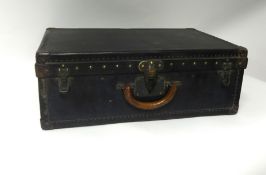 A Louis Vuitton old travel suitcase, 60cm x 39cm