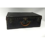 A Louis Vuitton old travel suitcase, 60cm x 39cm