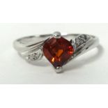 A white gold ring set with ruby style single stone, size S, stamped .750