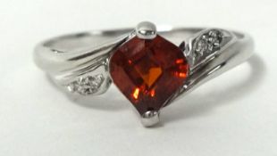 A white gold ring set with ruby style single stone, size S, stamped .750