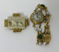A Ladies gilt metal and stone set dress watch t/w a carved bone and gilt metal brooch