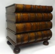 A 20th century chest of drawers made in the form of four large books with gilt decoration each