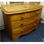 A Victorian bow fronted chest fitted with two short and two long drawers