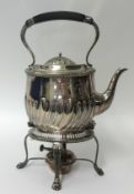 A silver plated spirit kettle with stand
