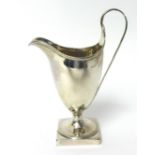 A George IV helmet shaped cream jug on square base by Peter and Anne Bateman, 94g