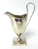 A George IV helmet shaped cream jug on square base by Peter and Anne Bateman, 94g