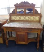 A traditional marble top washstand with tiled and mirrored back, (damaged marble)