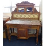 A traditional marble top washstand with tiled and mirrored back, (damaged marble)