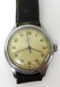 An early Gents Omega stainless steel wrist watch